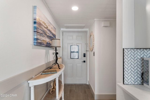 doorway to outside with dark wood-type flooring