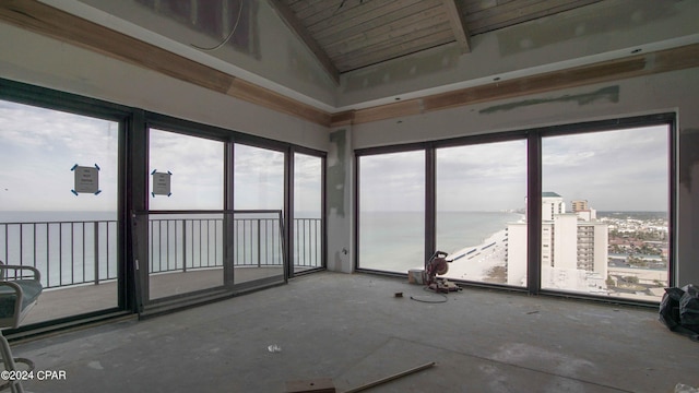 unfurnished sunroom with wooden ceiling, vaulted ceiling, and a water view