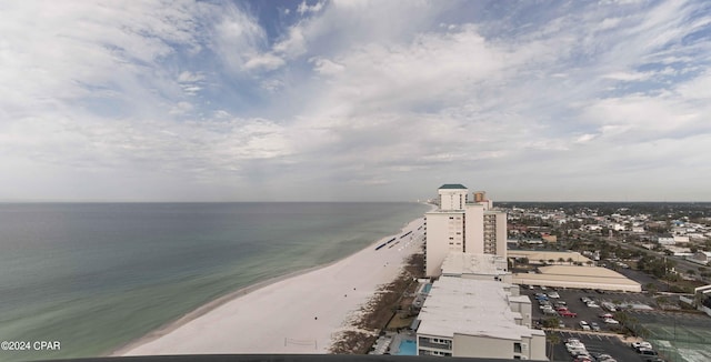 drone / aerial view featuring a view of the beach and a water view