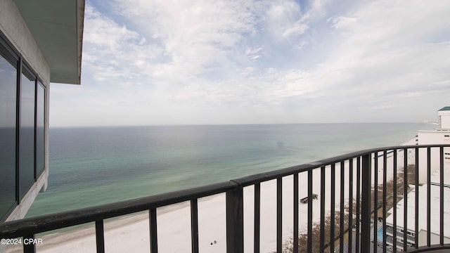 balcony featuring a water view