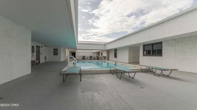 view of pool featuring a patio area