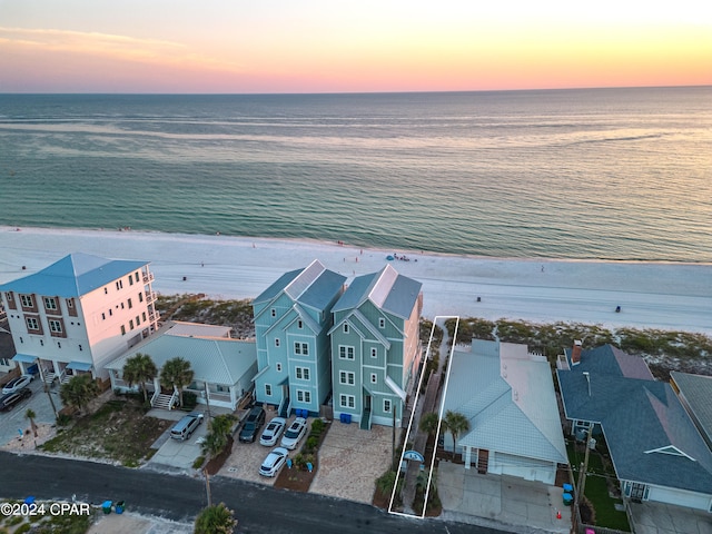 aerial view at dusk with a water view