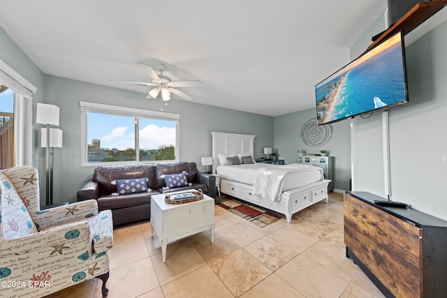 bedroom with light tile floors and ceiling fan