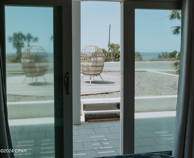 wooden terrace featuring a water view