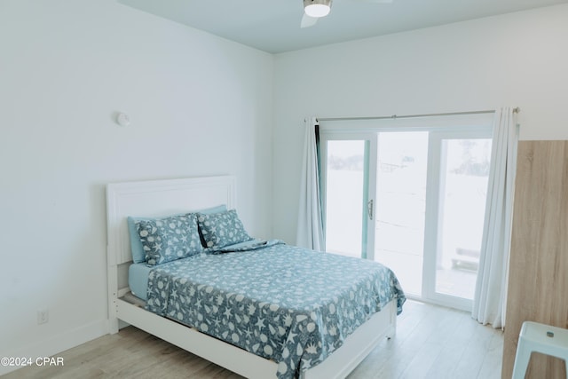 bedroom featuring baseboards, ceiling fan, light wood-type flooring, and access to exterior