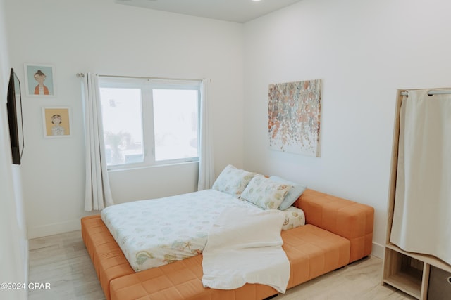 bedroom featuring baseboards