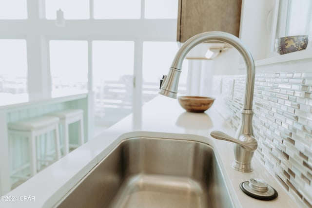 room details with light countertops and a sink