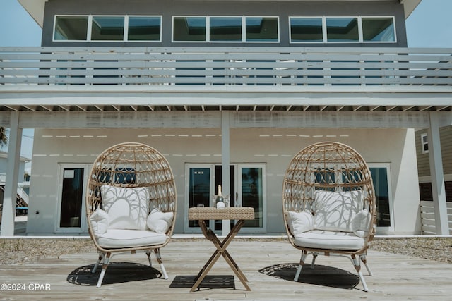 exterior space featuring a deck and stucco siding