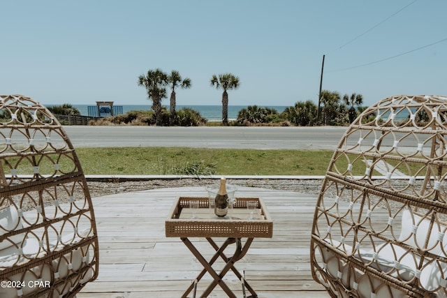 wooden deck with a water view