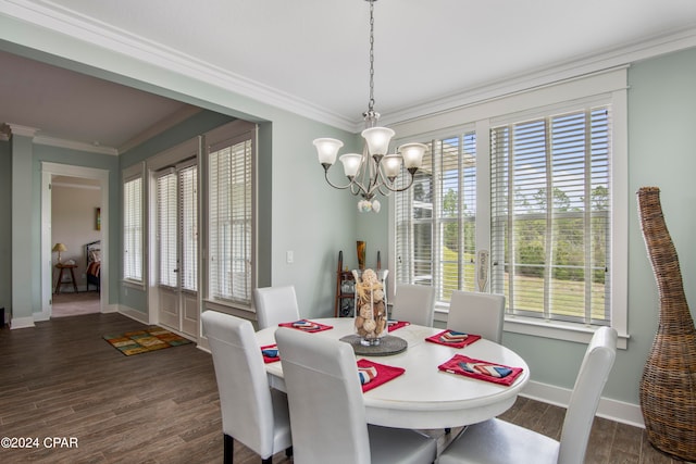 dining space featuring crown molding, a chandelier, a wealth of natural light, and dark hardwood / wood-style flooring