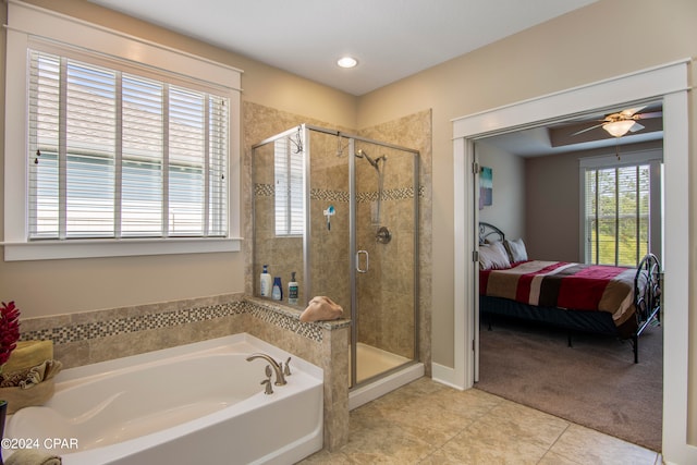 bathroom featuring tile floors, ceiling fan, and independent shower and bath