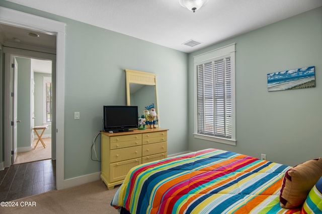 bedroom with light hardwood / wood-style floors