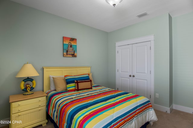 bedroom with carpet floors and a closet