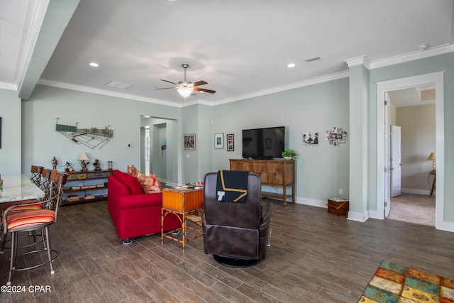 living room featuring ceiling fan, dark hardwood / wood-style floors, and crown molding