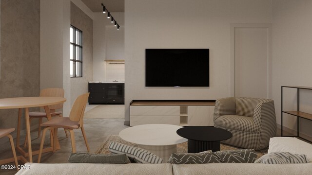 carpeted living room with brick wall and track lighting