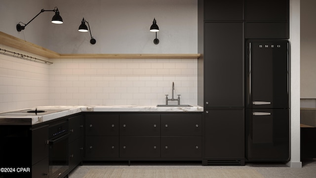 kitchen featuring backsplash, black appliances, and sink