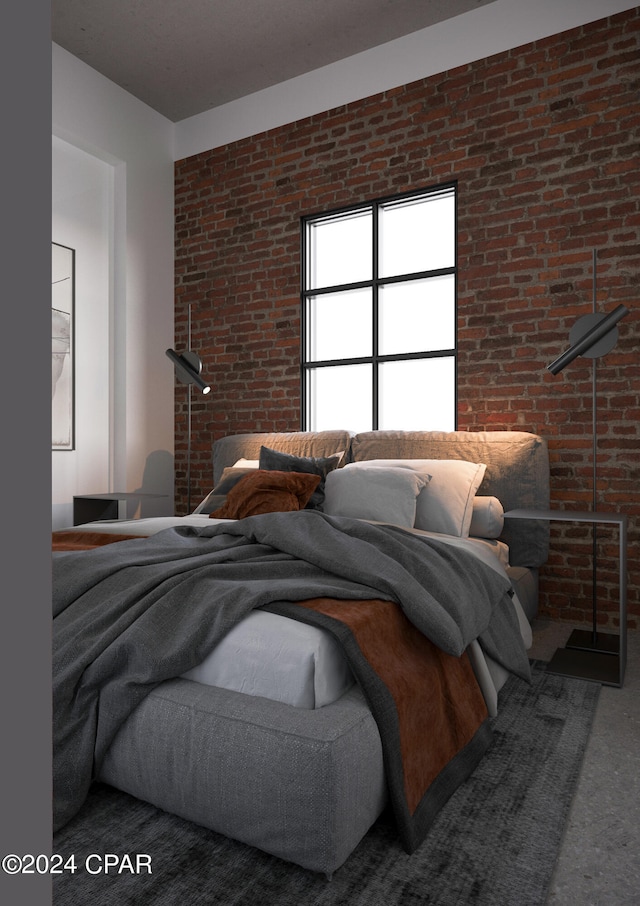 bedroom featuring brick wall