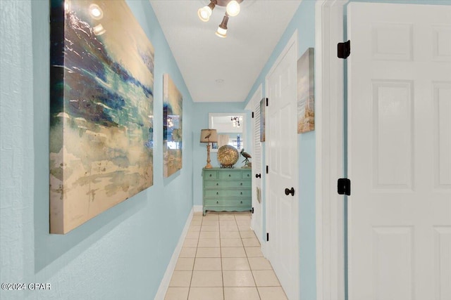 hallway featuring light tile floors