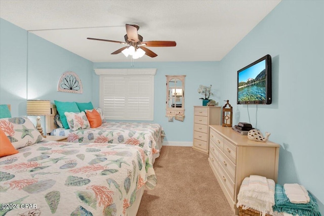 bedroom featuring light carpet and ceiling fan