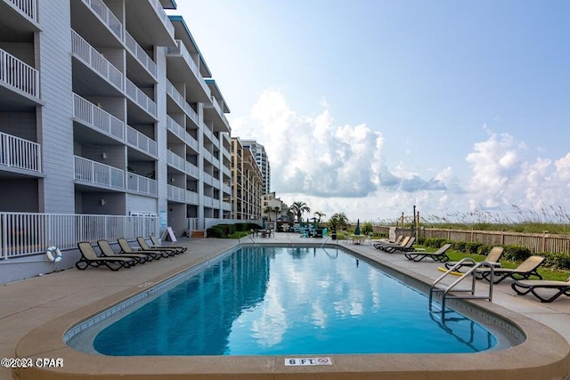 view of swimming pool featuring a patio area