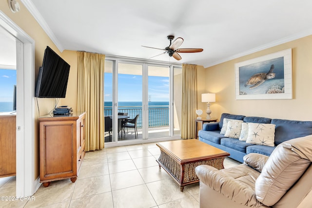 living room with ornamental molding, ceiling fan, light tile flooring, and a water view