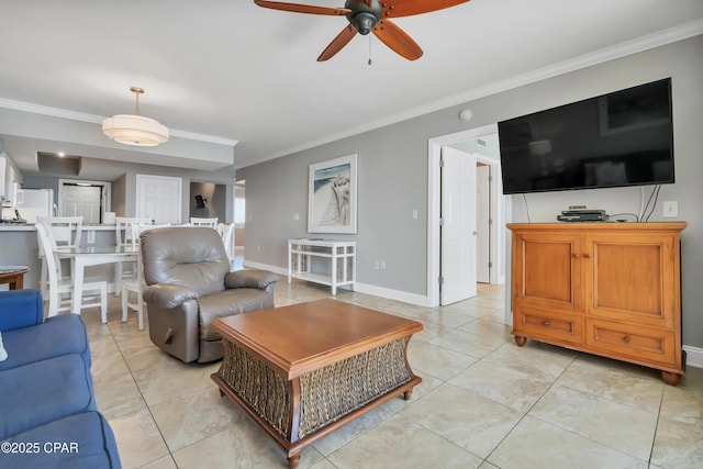 living room featuring baseboards, light tile patterned flooring, a ceiling fan, and crown molding