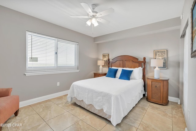 bedroom featuring light tile patterned floors, ceiling fan, and baseboards