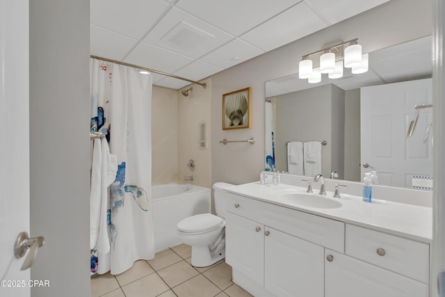 bathroom with vanity, tile patterned flooring, shower / bath combination with curtain, a paneled ceiling, and toilet