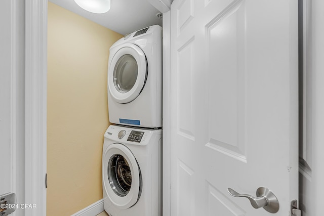 laundry room featuring laundry area and stacked washer and dryer