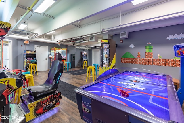 playroom featuring a garage and wood finished floors