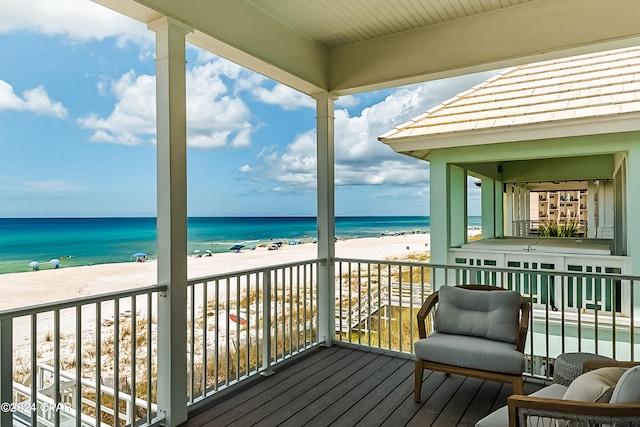 exterior space with a beach view and a water view