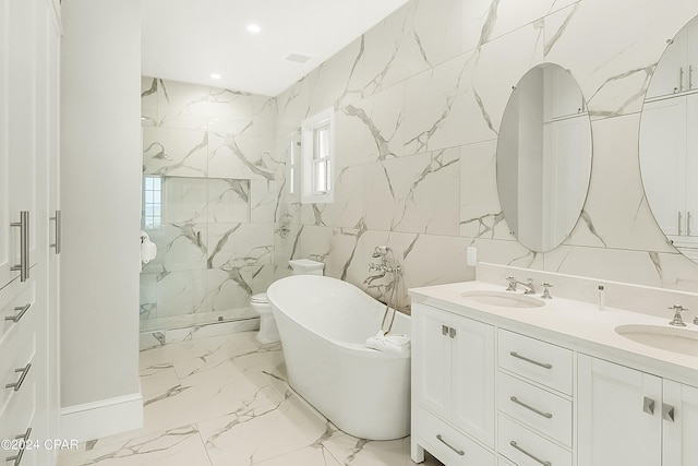 full bathroom featuring tile walls, toilet, double sink vanity, tile floors, and independent shower and bath