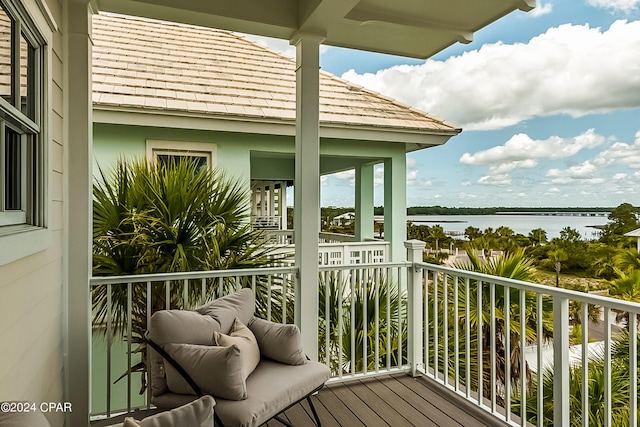 balcony featuring a water view