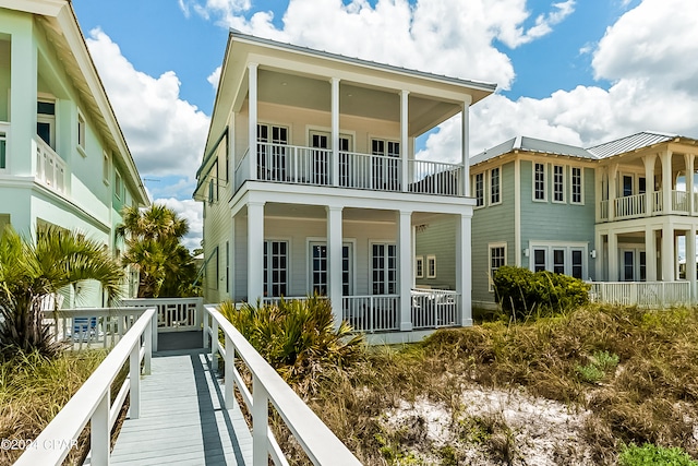 rear view of property with a balcony