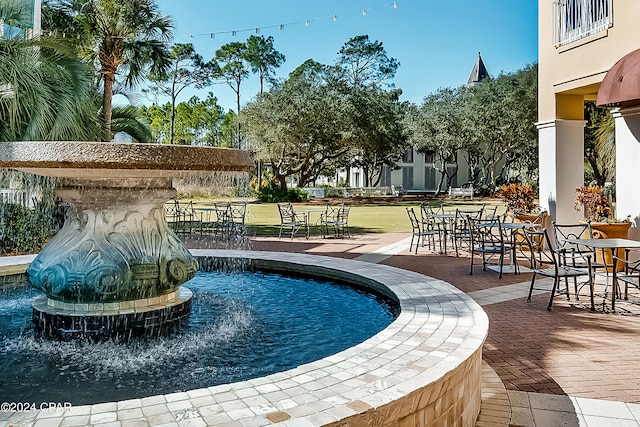 view of swimming pool with a patio area