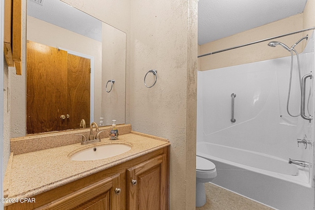 full bathroom featuring tile flooring, a textured ceiling, shower / bathing tub combination, toilet, and vanity