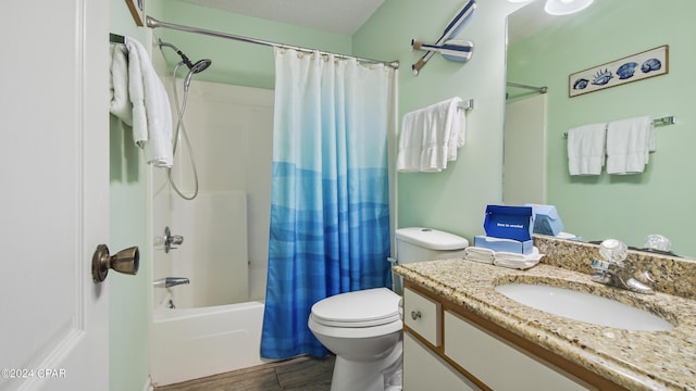 full bathroom featuring a textured ceiling, toilet, wood finished floors, vanity, and shower / tub combo with curtain