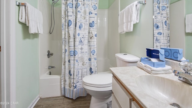 full bath with shower / bath combo with shower curtain, vanity, toilet, and wood finished floors