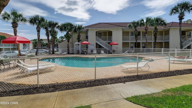 pool featuring a patio and fence