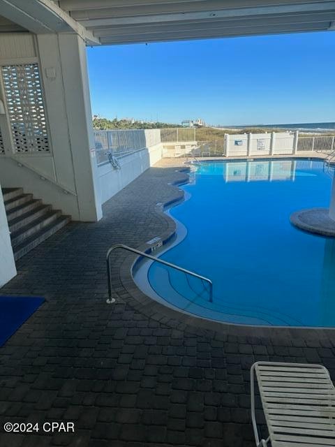 view of swimming pool featuring a patio