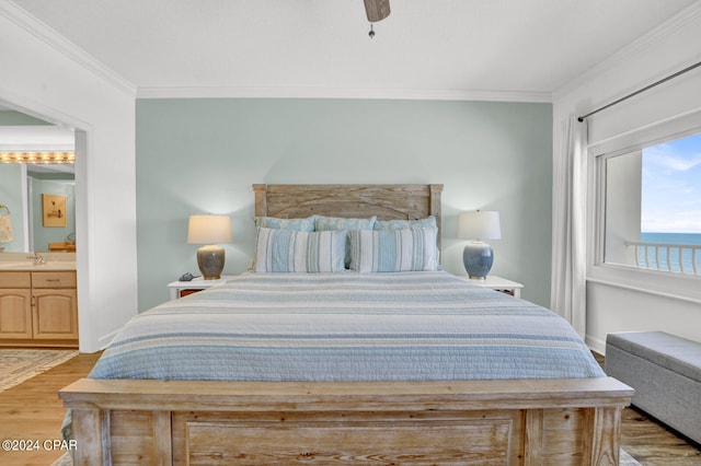 bedroom featuring connected bathroom, ornamental molding, sink, light hardwood / wood-style floors, and ceiling fan