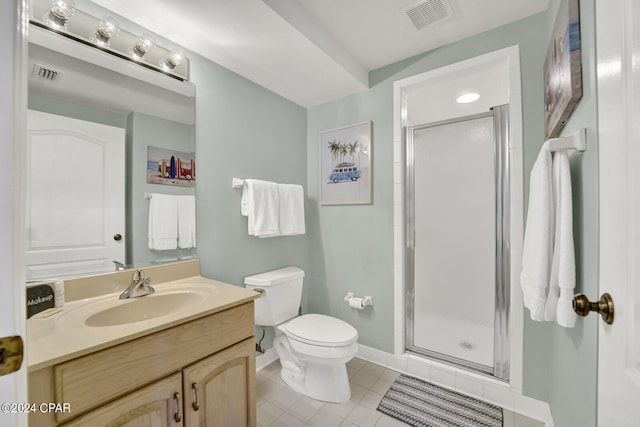 bathroom featuring tile flooring, vanity with extensive cabinet space, an enclosed shower, and toilet