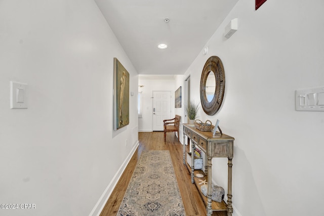 hall with dark hardwood / wood-style floors