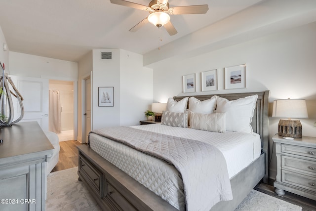 bedroom with ceiling fan and hardwood / wood-style flooring