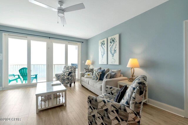 balcony with a water view and a view of the beach