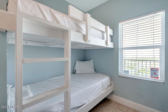 bedroom featuring light tile patterned flooring