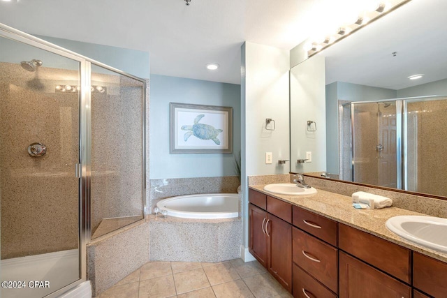 bathroom with shower with separate bathtub, vanity, and tile patterned floors