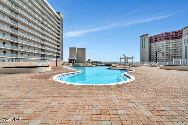 view of pool featuring a patio