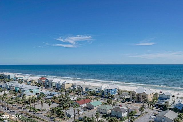 bird's eye view with a water view and a view of the beach