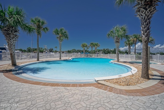 view of swimming pool with a patio